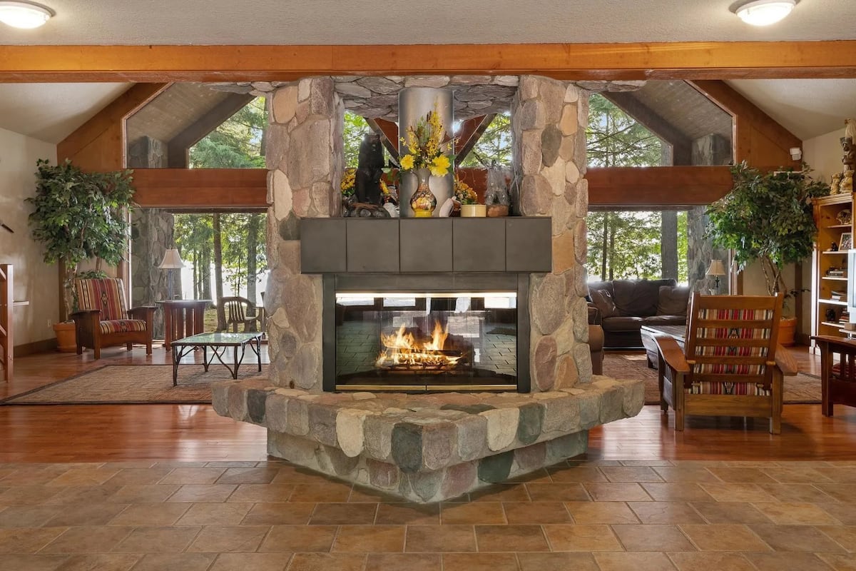 Central stone fireplace in the lodge great room