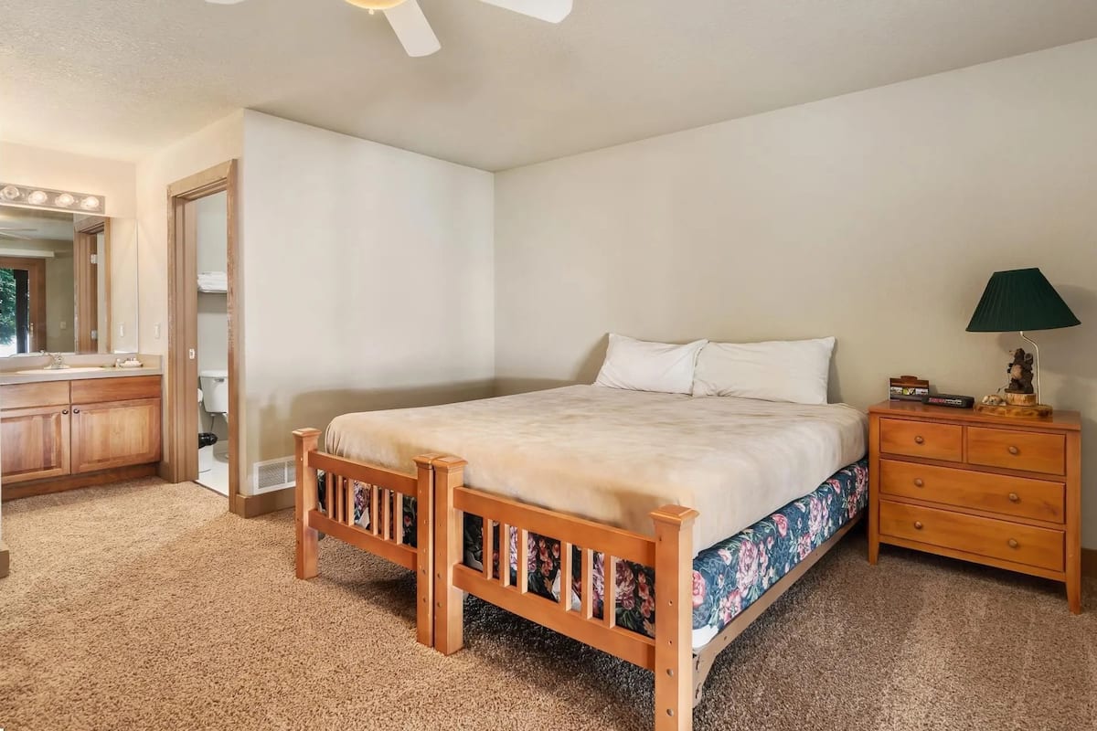 Lodge king bedroom with an adjoining bathroom vanity